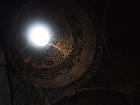 Geghard Monastery in Armenia. The Monastery of the spear, Light penetrates into the hole in the dome