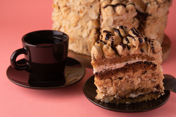photo brown cup and a cut piece of pecan cake on a saucer