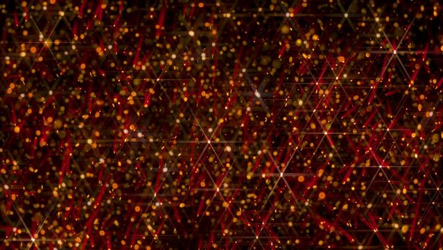 A composite video of red and gold light particles trailing in random falling patterns against a dark background.