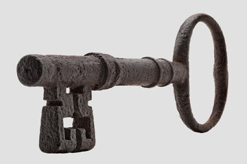 Antique iron key oblique perspective view on a plain light background