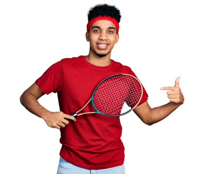 Young african american man wearing tennis player uniform smiling happy pointing with hand and finger