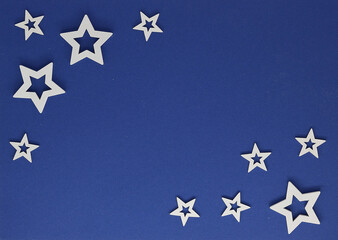 Christmas card with white stars on a blue background