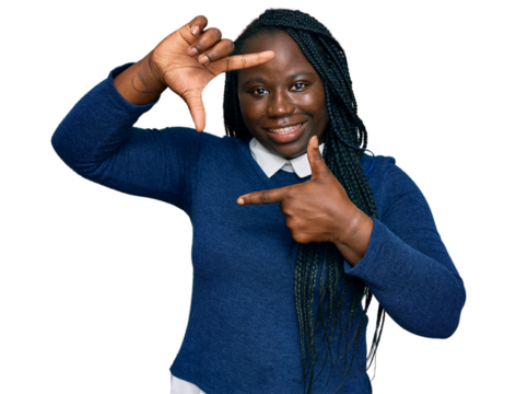 Young black woman with braids wearing casual clothes smiling making frame with hands and fingers with happy face. creativity and photography concept.
