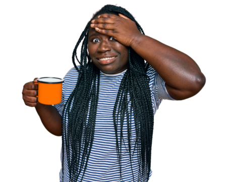 Young black woman with braids drinking a cup coffee stressed and frustrated with hand on head, surprised and angry face