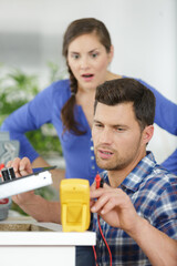 professional electrician man is fixing the critical problem of electric