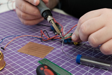 work on electronic connections with the soldering iron