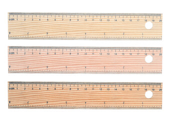 Classic wooden ruler for precisely drawing isolated on white background. Three shades of wood