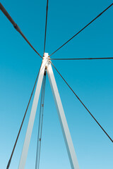 Fototapeta premium suspension bridge over blue sky