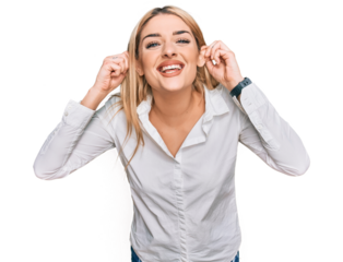 Young caucasian woman wearing casual clothes smiling pulling ears with fingers, funny gesture. audition problem