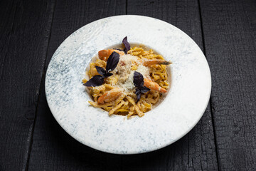 delicious pasta on a dark table in a restaurant

