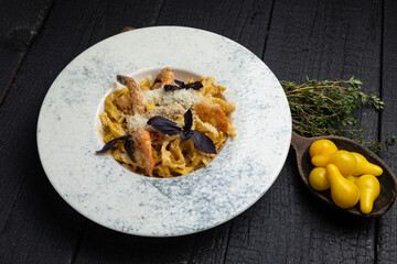 delicious pasta on a dark table in a restaurant
