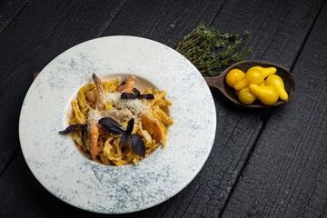 delicious pasta on a dark table in a restaurant
