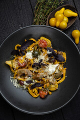 delicious pasta on a dark table in a restaurant
