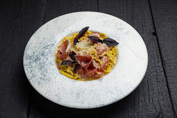 delicious pasta on a dark table in a restaurant
