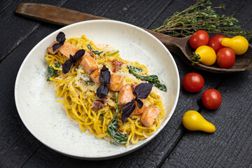 delicious pasta on a dark table in a restaurant
