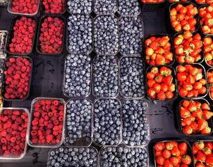 buying fruits and  berries ( raspberries, blueberries, blueberries, strawberries, gooseberries)at...