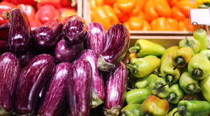 buying vegetables(cucumbers, tomatoes, onions, peppers, eggplant, zucchini) at the market