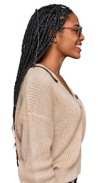 African american woman wearing casual clothes looking to side, relax profile pose with natural face and confident smile.