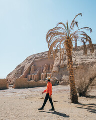 person walking in desert in abu simbel egypt