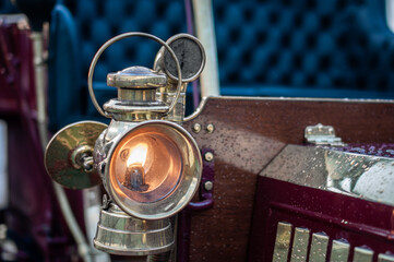 Gas headlight of vintage, veteran car on a classic car show in Brighton, East Sussex, UK