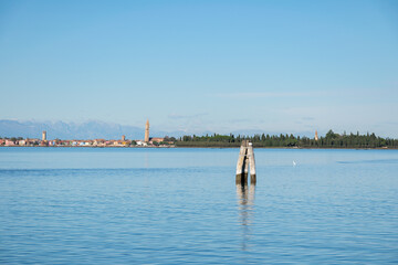 Fototapeta premium Burano view from Sant'Erasmo, with the Alps in the background
