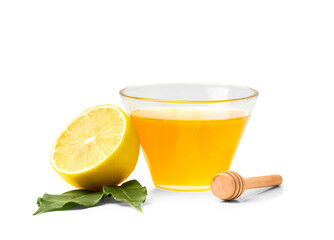 Honey with lemon on white background.