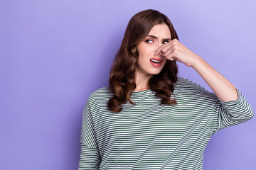 Photo of irritated glamour girl arm fingers hold cover nose look empty space isolated on purple...