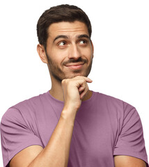 Portrait of young man in purple t-shirt with dreamy cheerful expression, thinking