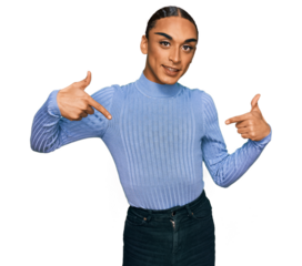 Hispanic transgender man wearing make up and long hair wearing casual clothes looking confident with smile on face, pointing oneself with fingers proud and happy.