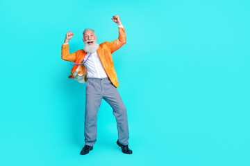 Full length photo of delighted crazy aged man raise fists achieve empty space isolated on cyan...