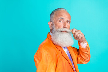 Profile photo of confident aged person hand touch fix mustache look empty space isolated on teal...