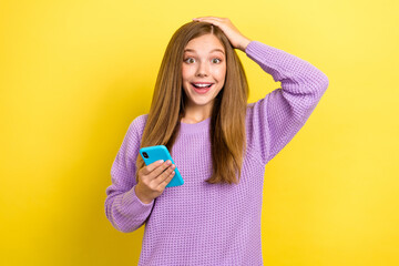 Photo of young excited positive shocked girl eshopping sale offer proposition low prices black friday good mood isolated on bright yellow color background
