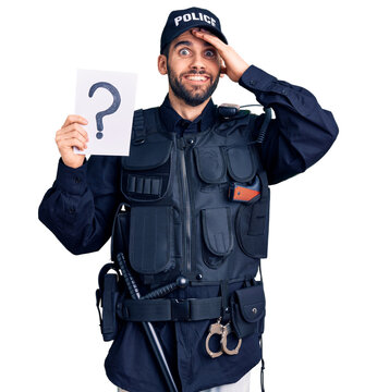 Young handsome man with beard wearing police uniform holding question mark stressed and frustrated with hand on head, surprised and angry face