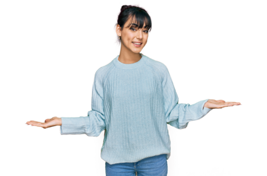 Young hispanic woman wearing casual clothes smiling showing both hands open palms, presenting and advertising comparison and balance