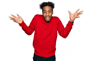 Young african american man with beard wearing casual winter sweater celebrating crazy and amazed for success with arms raised and open eyes screaming excited. winner concept