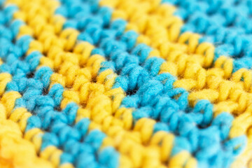 Knitted fabric with two-tone yellow and blue stripes in flat detail
