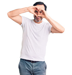 Middle age handsome man wearing casual t-shirt doing heart shape with hand and fingers smiling looking through sign