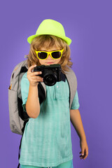 Kid with travel camera on vacation. Child travel and adventure concept.