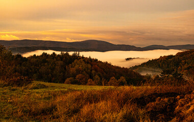 beautiful view from the mountains to the misty valley in autumn