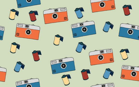 old film cameras in two colors orange and blue with rolls of film in between on a yellow-green background. retro seamless patterns