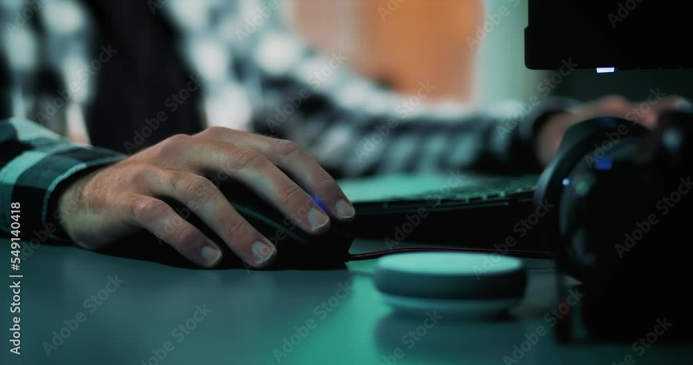 Poster close-up of male hands working, typing, scrolling and editing on computer mouse and keyboard. freela