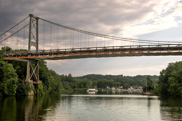 Kingston, NY - USA - Aug 2, 2022 Horizontal view of the iconic Wurts Street Bridge, spanning the Rondout Creek at sunset, in Kingston, New York.