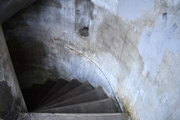 old spiral stairway made of concrete and creepiness 