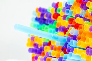 Heap of colorful plastic straws for drinks as background, closeup view macro plastic tubes, Fancy straw multicolor background