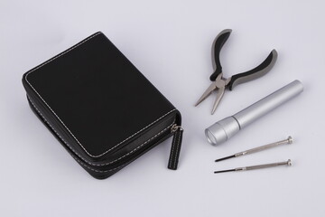 Various tools and a small stitched case