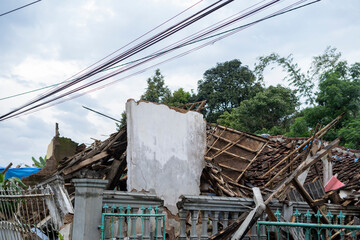 Homes were damaged triggered by the 5.6 magnitude earthquake that killed at least 271 people, with hundreds injured.