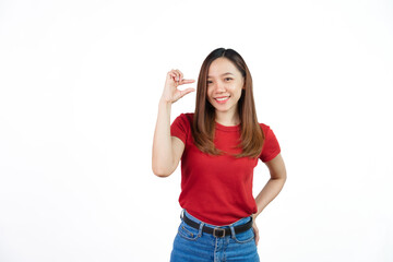 Obraz na płótnie Canvas Pretend to hold small objects, Pretty Asian people wearing red t-shirt for a woman isolated on white background.