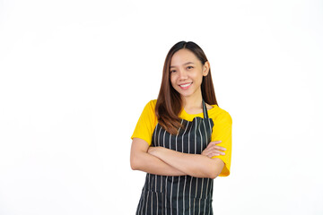 Looking to camera, Portrait of confident asian woman barista and food owner shop with yellow t-shirt and black apron standing on white background.