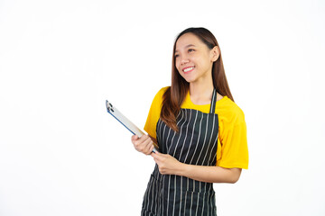 Holding menu on clipboard, Portrait of confident asian woman barista and food owner shop with yellow t-shirt and black apron standing on white background.