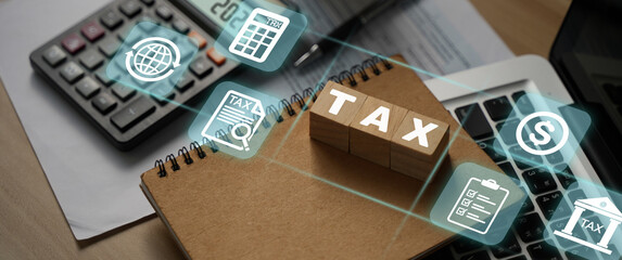 Tax word and number 2021 displayed on a wooden block. Business and tax ideas. Pay taxes in 2022....